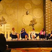 Leadership panel discussion on a conference stage